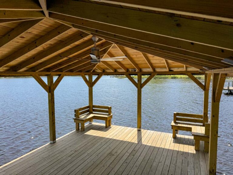 custom dock with roof, benches, electrical and a fan